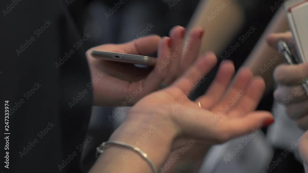 woman tells something to the customers or clients, close up of female hands woman tells something to the customers or clients, close up of female hands