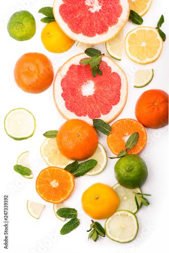 Citrus background. Fresh citrus fruits - Lemons, oranges, limes, grapefruits on the white background
