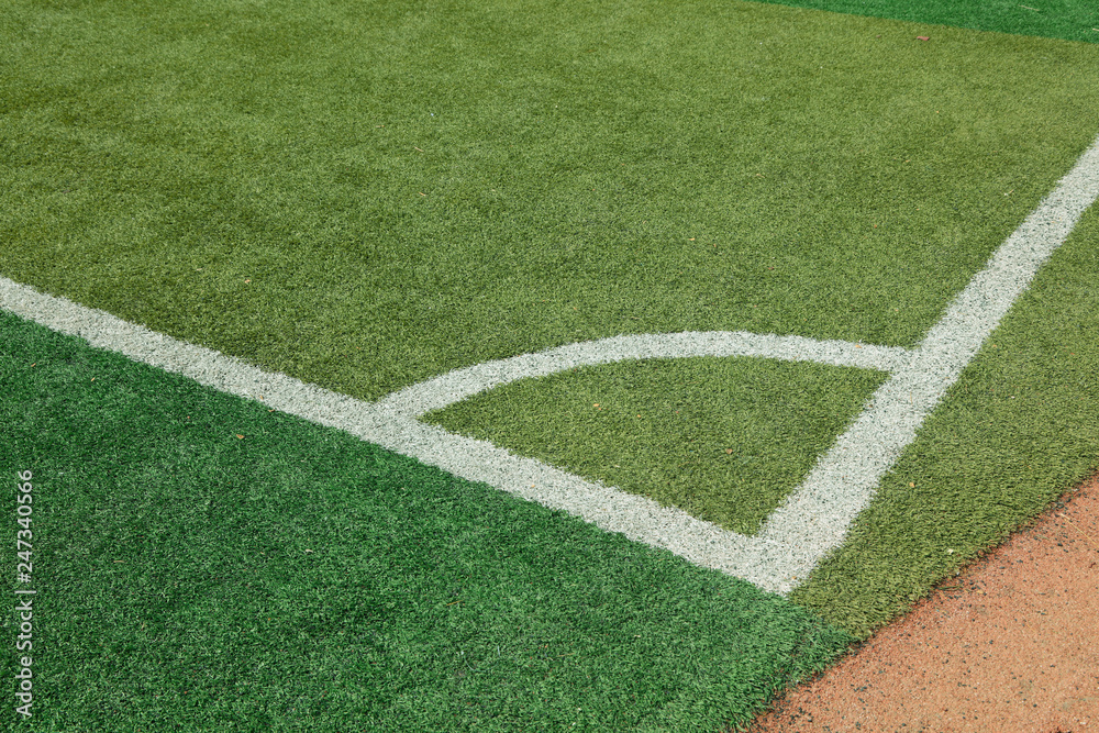 White sideline on the green plastic playground