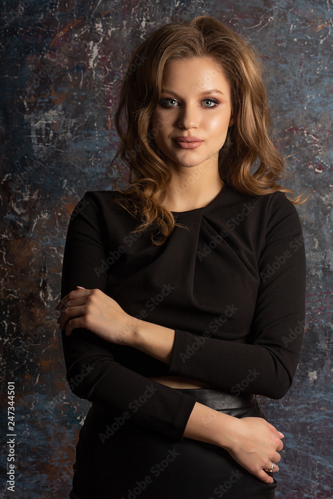 Studio portrait of attractive blonde model with beautiful makeup and hairstyle Studio portrait of attractive blonde model with beautiful makeup and hairstyle