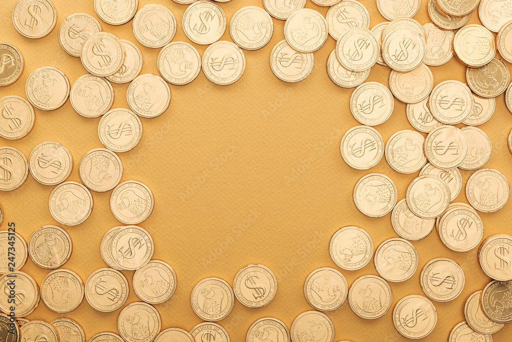 top view of golden coins with dollar signs isolated on orange with copy space, st patrick day concept top view of golden coins with dollar signs isolated on orange with copy space, st patrick day concept