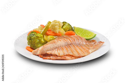 Grilled Fish fillet served with vegetables on white background