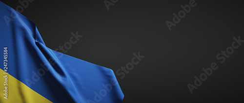 Ukraine flag fabric on plain dark background