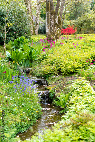 Garden in summer with water cascade