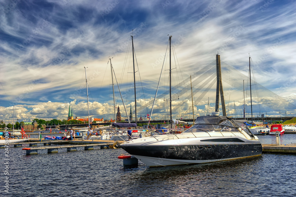 Yachts on the background of the city of Riga in the summer