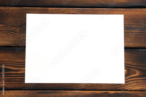 Paper. Paper on wooden background. Isolated with plenty of room for your text.