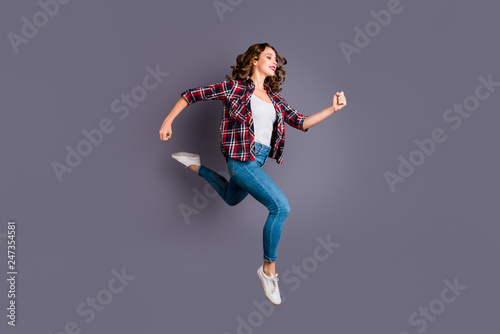 Full length size body photo of fly high attractive beautiful she her girl want to be in time for black friday sale discount wearing casual checkered plaid shirt jeans denim isolated grey background