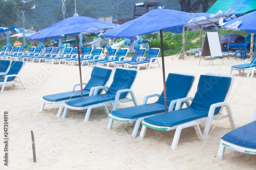 Beach summer holiday with chair and umbrella 