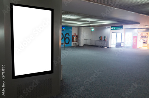 mock up of vertical blank advertising billboard or light box showcase with people waiting at airport, copy space for your text message or media content, advertisement, commercial and marketing concept