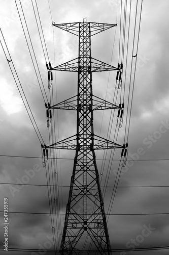 Electricity transmission pylon, High-voltage transmission tower silhouetted