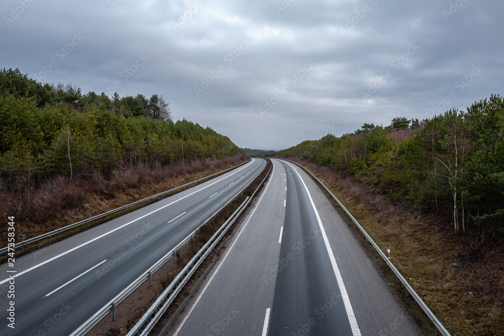empty german highway on a dark grey morning