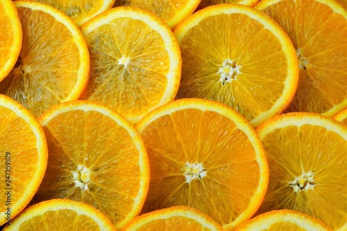 Orange background for creative design and creativity. Orange-the most common citrus culture in all tropical and subtropical regions of the world, is widely used in cooking: drinks, jams, cakes.