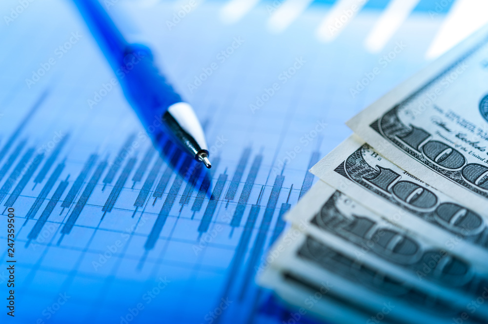 Finance background with money, stock market chart, graph and pen. Economy and business concept. Finance background with money, stock market chart, graph and pen. Economy and business concept.