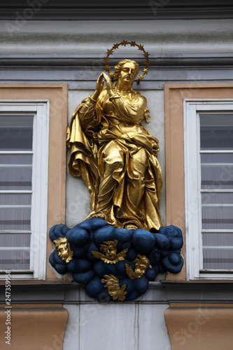 Statue of Virgin Mary on the façade of the house in Prague