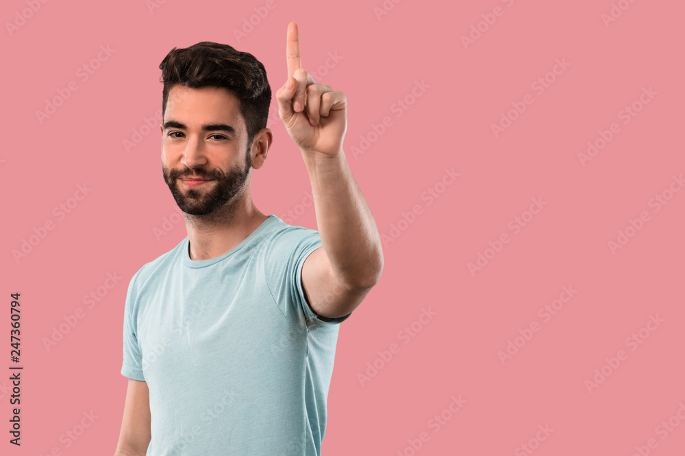 Fototapeta premium young man doing number one gesture