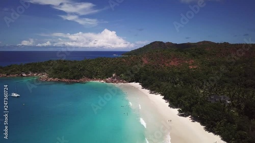 Aerial view of paradise beach, palms and blue lagoon