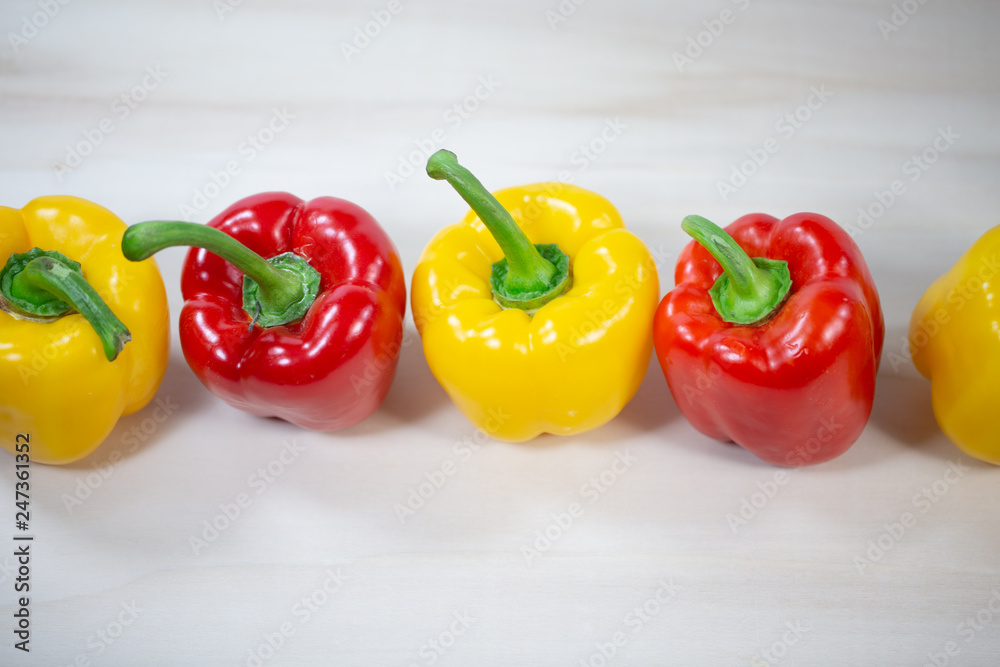 yellow and red peppers in a row yellow and red peppers in a row