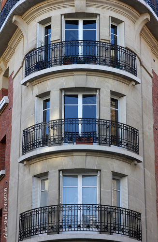 Facade of a traditional apartmemt building in Paris, France