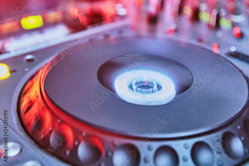 DJ playing disc with mixing music on turntables dj equipment