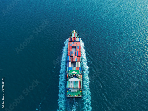 Aerial view container ship full speed for logistics shipping, import export or transportation concept background.