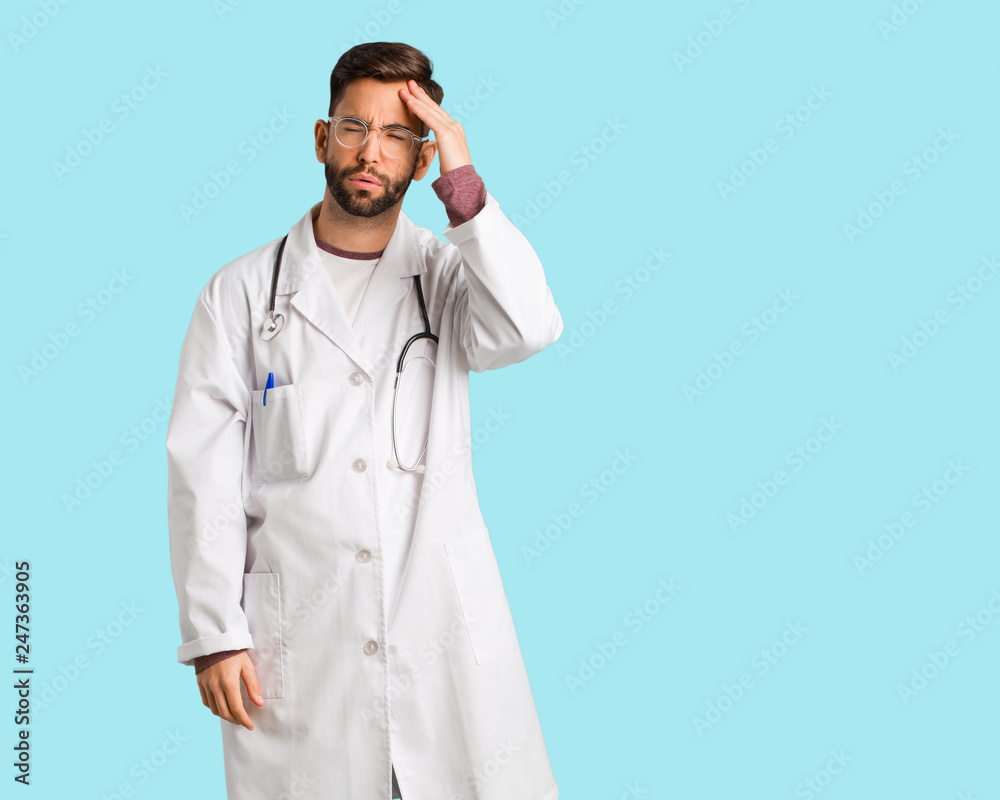 Young doctor man tired and very sleepy Young doctor man tired and very sleepy