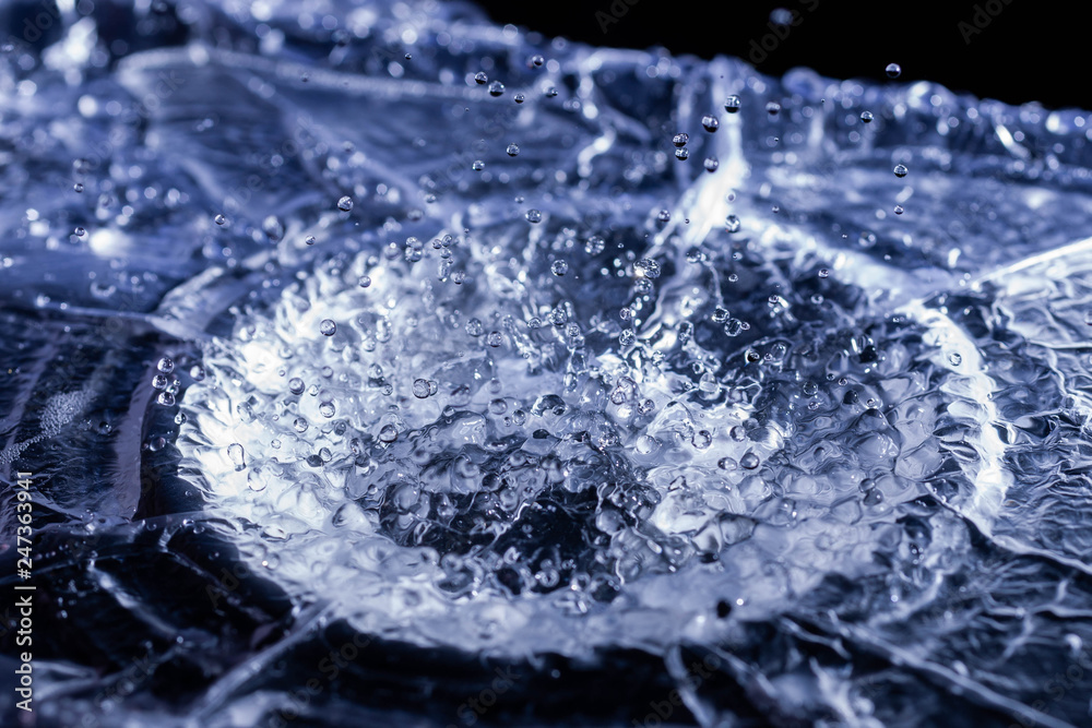 Water drops splashing on acoustic membrane. A lot of drops in air. High frequency of sound waves. Water cloud small drops. Frozen time shot. Water drops splashing on acoustic membrane. A lot of drops in air. High frequency of sound waves. Water cloud small drops. Frozen time shot.