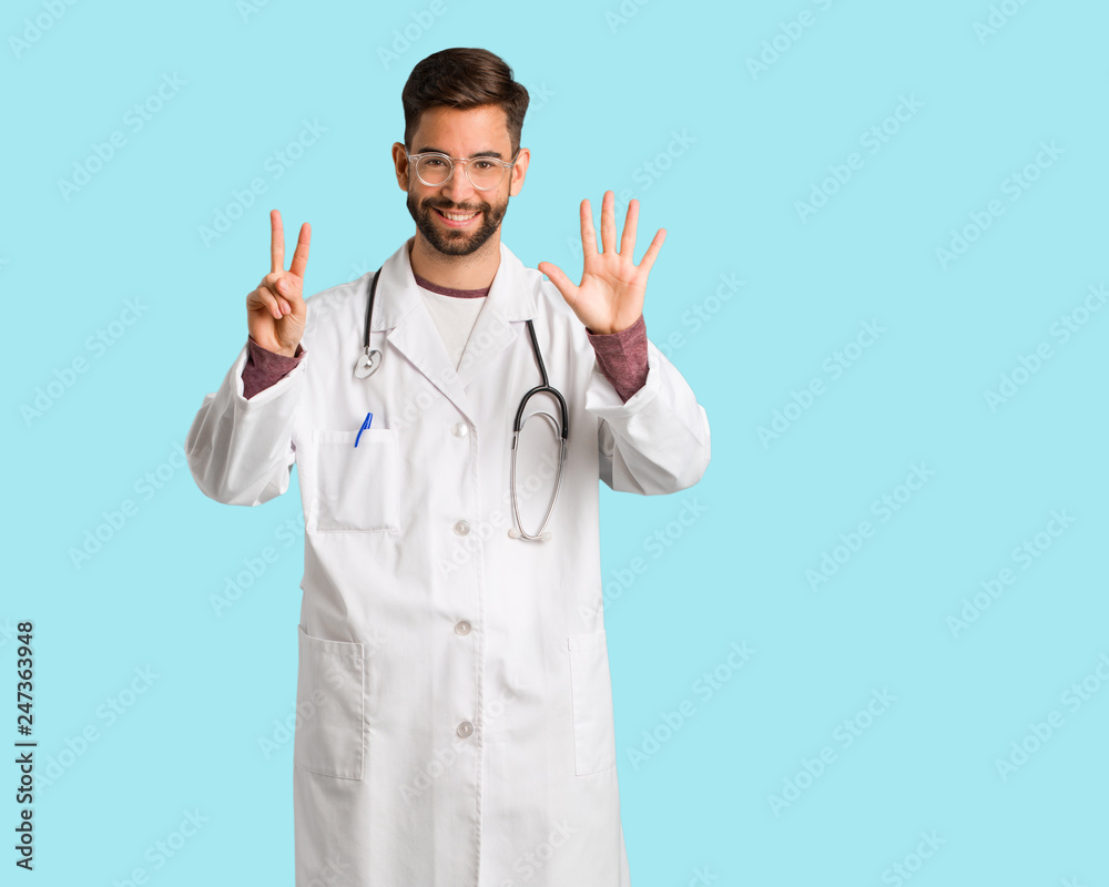 Young doctor man showing number seven Young doctor man showing number seven
