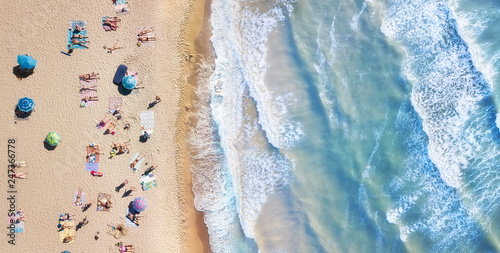 Beach and waves from top view. Turquoise water background from top view. Summer seascape from air. Top view from drone. Travel-image