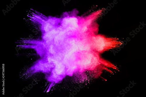 Colorful powder explosion on black background.