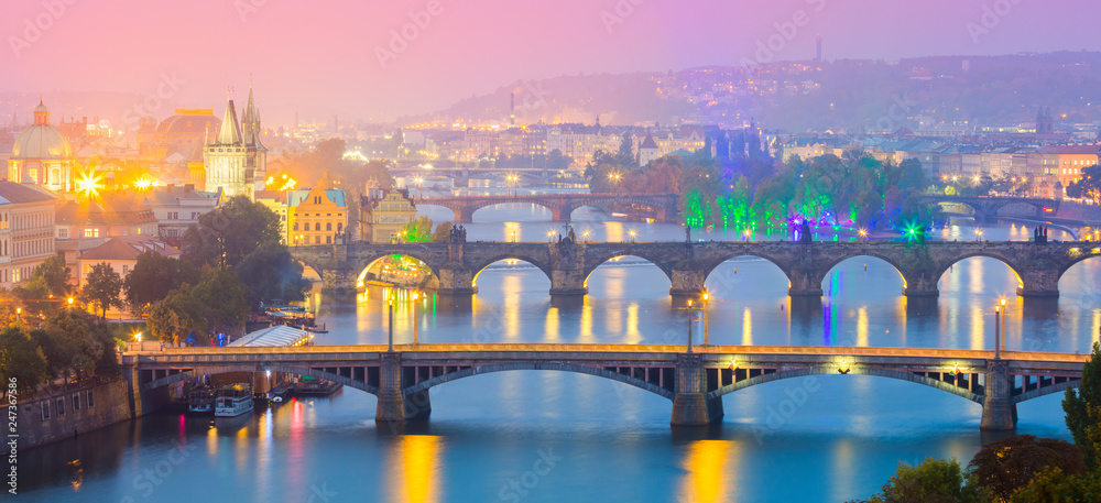 Panoramic view of Prague landmarks at sundown or night time, most popular place