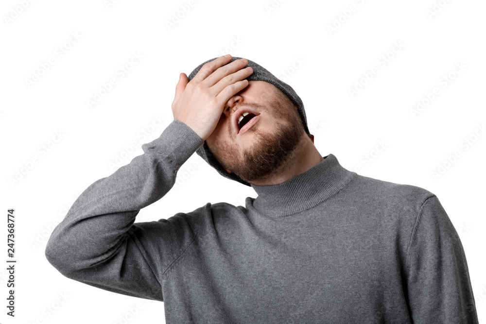 Oh my God! portrait of sad bearded man in gray hat on white background Oh my God! portrait of sad bearded man in gray hat on white background