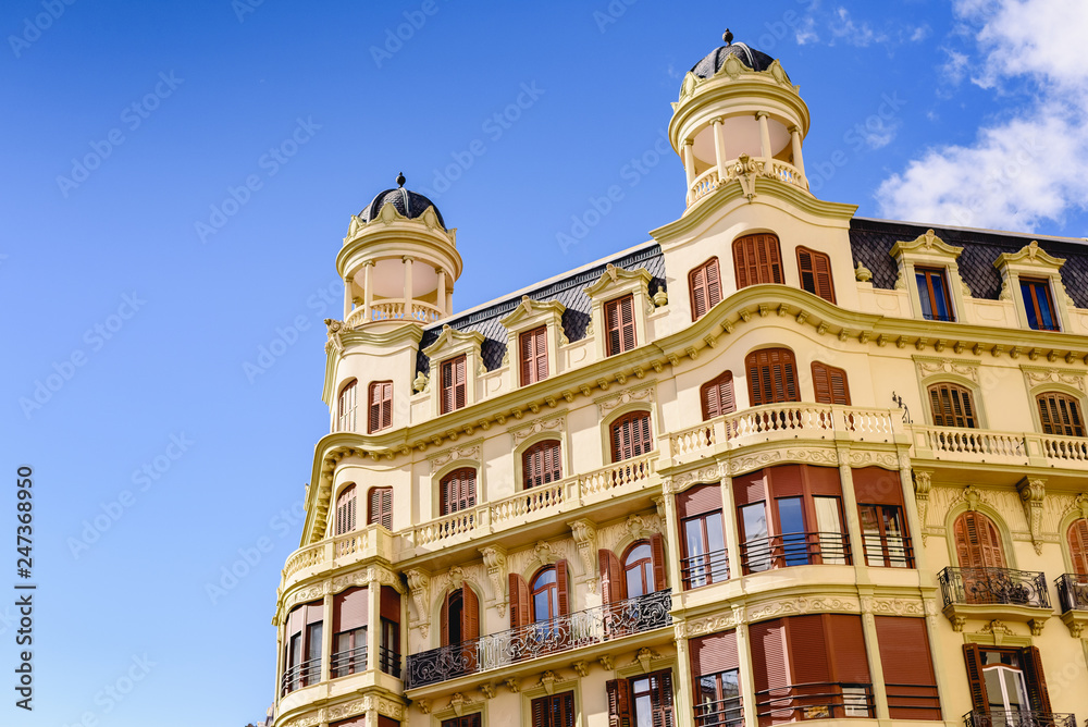 Valencia, Spain - February 2, 2019: Historic building in the center of Valencia, currently dedicated to housing, on Castello street.