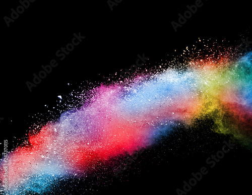 Colorful powder explosion on black background.