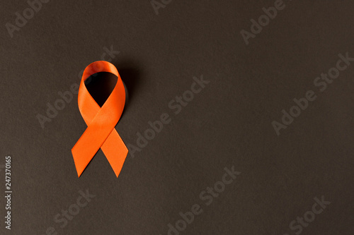 Orange ribbon. Healthcare and medicine concept. Multiple Sclerosis awareness. Leukemia awareness. Empty text space.