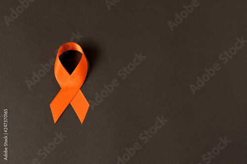 Orange ribbon. Healthcare and medicine concept. Multiple Sclerosis awareness. Leukemia awareness. Empty text space.