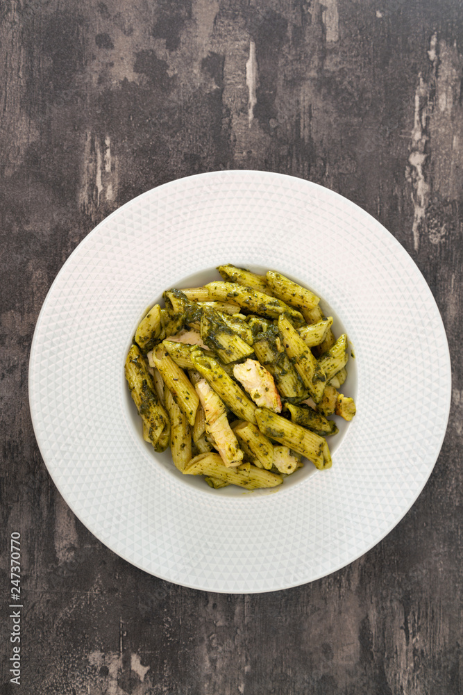 Pasta with pesto sauce and nuts on a the table Pasta with pesto sauce and nuts on a the table