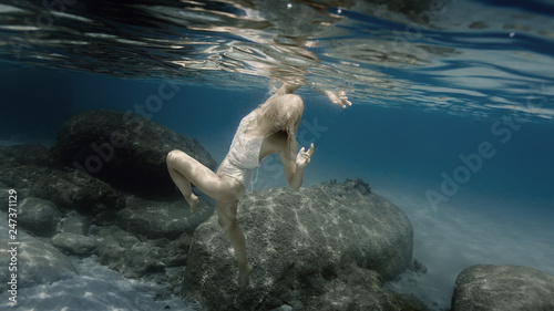 Photography Woman in white under water in the sea