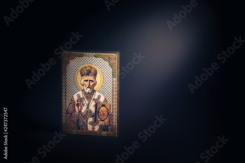 Orthodox icon of St. Nicholas on a black background.