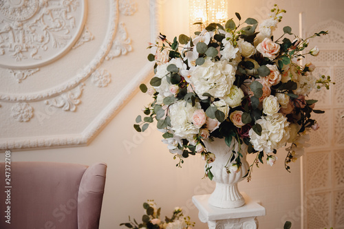 Artificial flowers in bouquet, real sensations, on white background photo