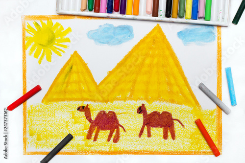 colorful drawing: Pyramids and camels in the desert