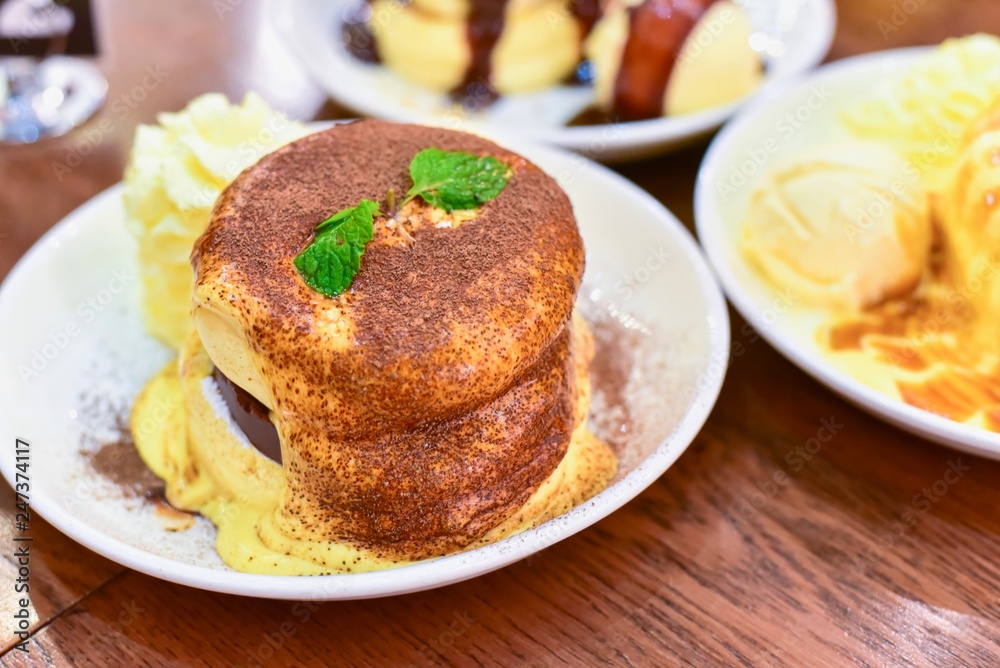 Close-Up View of Japanese Tiramisu Souffle Pancakes Close-Up View of Japanese Tiramisu Souffle Pancakes