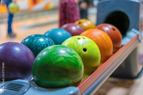 Colorful Bowling balls on ball return close up