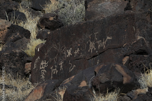 Ancient Native American rock art along the Rinconada Trail in Petroglyph National Monument, Albuquerque, New Mexico photo