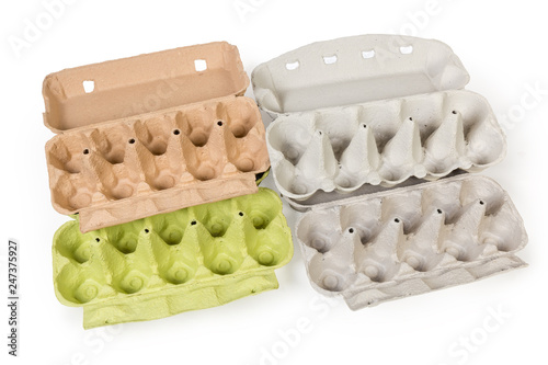 Different open empty pulp egg cartons on white background