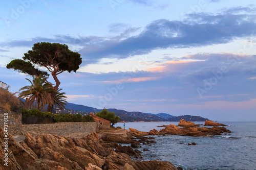 Holidays in France. Coastline in le Lavandou, stone ecological trail with stairs, costal path along the rocky coast of Mediterranean sea. Var, Cote d'azur, French Riviera.