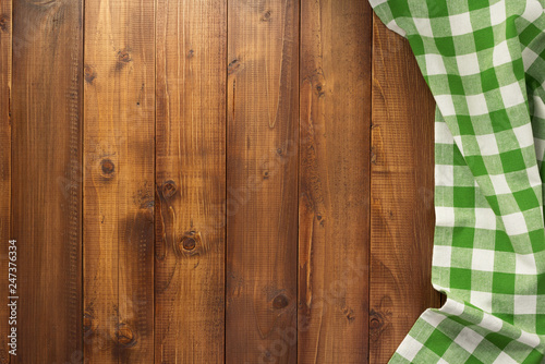 checked table cloth at wooden background