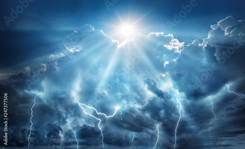 Religious and scientific apocalyptic background. Dark sky with lightning and dark clouds with the Sun that represents salvation and hope.