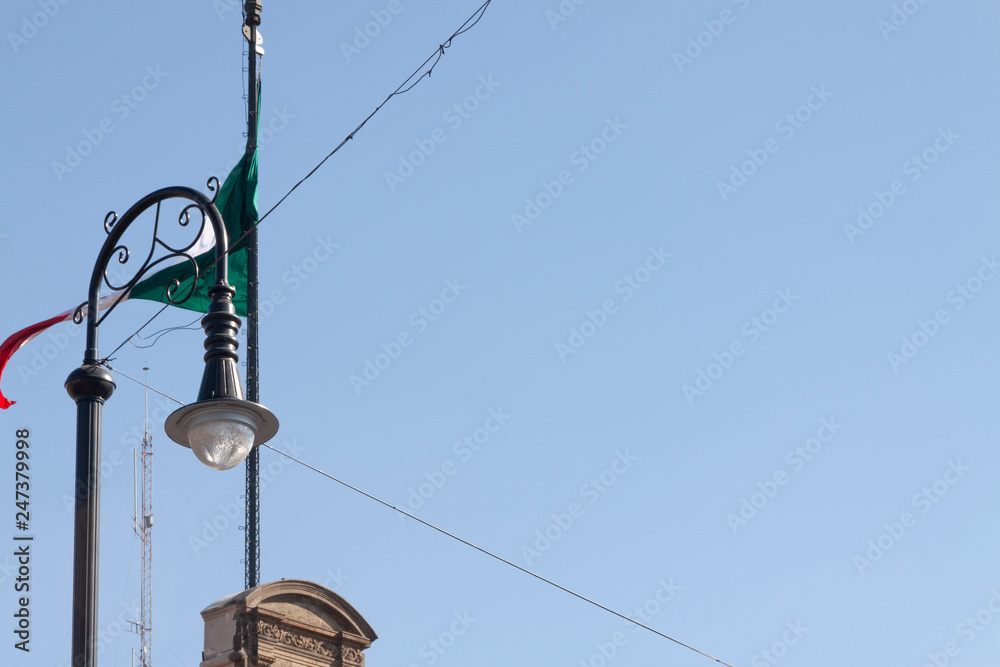 Details of Public lamp with blue sky background in Palacio de Gobierno or National Palace. Details of Public lamp with blue sky background in Palacio de Gobierno or National Palace.