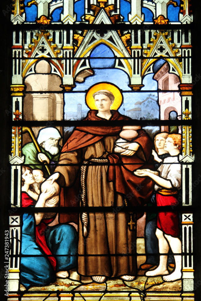 Saint Anthony distributes bread, stained glass, Saint Severin church, Paris, France