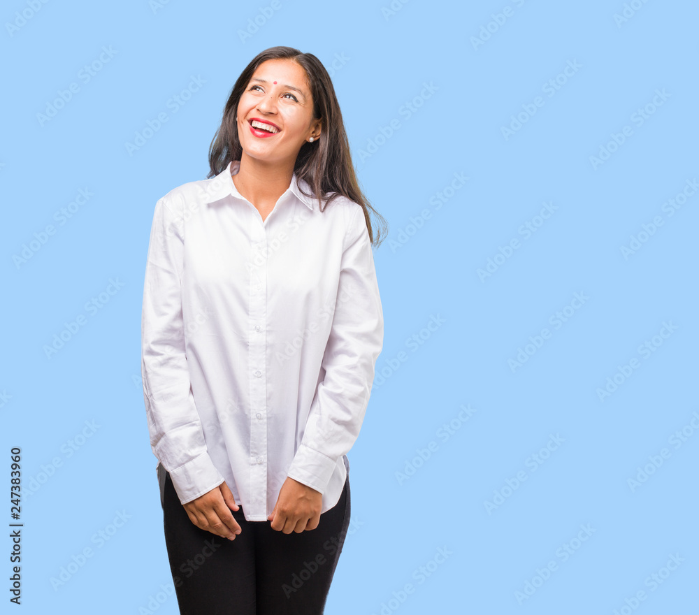 Portrait of a young indian woman cheerful and with a big smile, confident, friendly and sincere, expressing positivity and success Portrait of a young indian woman cheerful and with a big smile, confident, friendly and sincere, expressing positivity and success